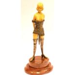 Dominatrix figurine of ivorine and cast metal on a marble base H: 30 cm. P&P Group 2 (£18+VAT for