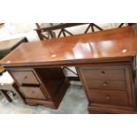 Large kneehole mahogany desk with drawers in both pedestals. This lot is not available for in-