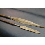 Two Ethnic metal spears with wooden shafts. This lot is not available for in-house P&P.