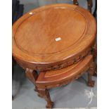 Circular Oriental hardwood coffee table with four matching occasional table all heavily carved and