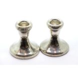 Pair of hallmarked silver stub candlesticks, H: 6 cm filled. P&P Group 1 (£14+VAT for the first