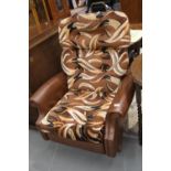 Brown leather retro type rocking armchair. This lot is not available for in-house P&P
