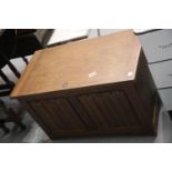 Vintage type oak blanket box with linenfold decorated front panel, 76 x 43 x 46 cm. This lot is