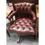 Oxblood red leather button back captains swivel chair. This lot is not available for in-house P&P