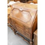 Antique oak drop front bureau with two lower drawers, 75 x 41 x 102 cm. This lot is not available