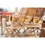 Collection of garden furniture including two tables and six folding chairs by Scancroft Danish