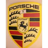 Cast iron Porsche shield sign, 30 x 22 cm. P&P Group 2 (£18+VAT for the first lot and £2+VAT for