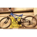 Typhoon muddyfox mountain bike with full suspension and 17" frame. This lot is not available for