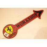 Cast iron Ferrari Workshop arrow sign, 41 x 12 cm. P&P Group 2 (£18+VAT for the first lot and £2+VAT