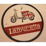 Cast iron Lambretta scooter circular sign, D: 28 cm. P&P Group 2 (£18+VAT for the first lot and £2+