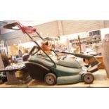 Qualcast powertrax lawn mower with trimming strimmer. This lot is not available for in-house P&P