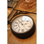 Outdoor hanging wall clock marked Kensington London. This lot is not available for in-house P&P