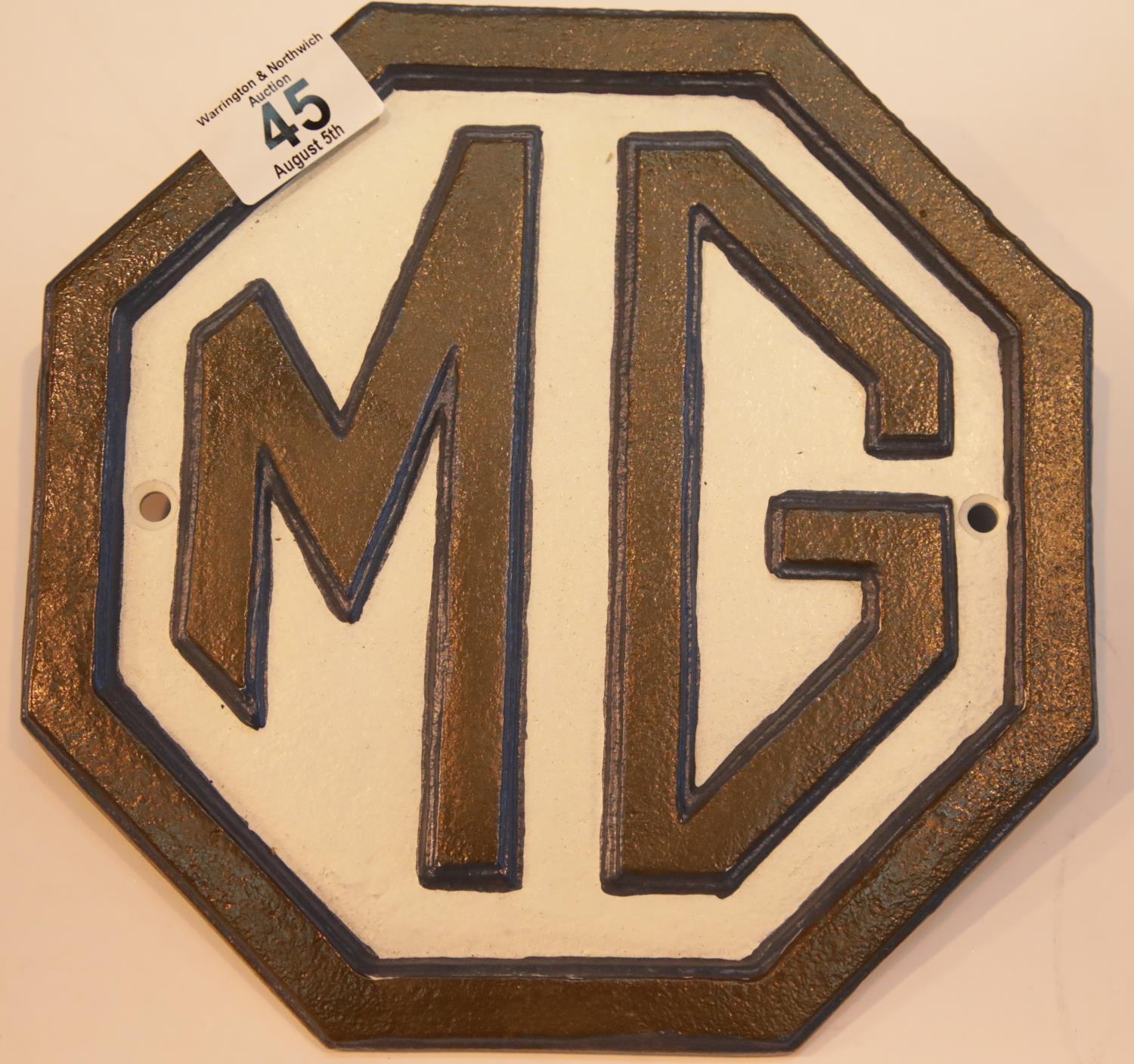 Cast iron MG black and white sign, 24 x 24 cm. P&P Group 2 (£18+VAT for the first lot and £2+VAT for