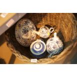 Vintage cane basket containing blue and white ceramics. This lot is not available for in-house P&P