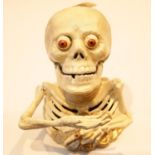 Cast iron Skeleton moneybox, H: 16 cm. P&P Group 3 (£25+VAT for the first lot and £5+VAT for