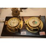 Vintage type brass bulkhead clock and barometer by Nauticlia and a brass candle wall light. This lot