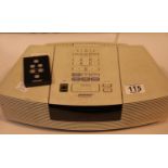 Retro Bose wave radio/CD alarm clock with remote. P&P Group 3 (£25+VAT for the first lot and £5+