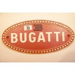 Cast iron Bugatti sign, 34 x 17 cm. P&P Group 2 (£18+VAT for the first lot and £2+VAT for subsequent