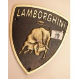 Cast iron Lamborghini shield sign, 22 x 19 cm. P&P Group 2 (£18+VAT for the first lot and £2+VAT for