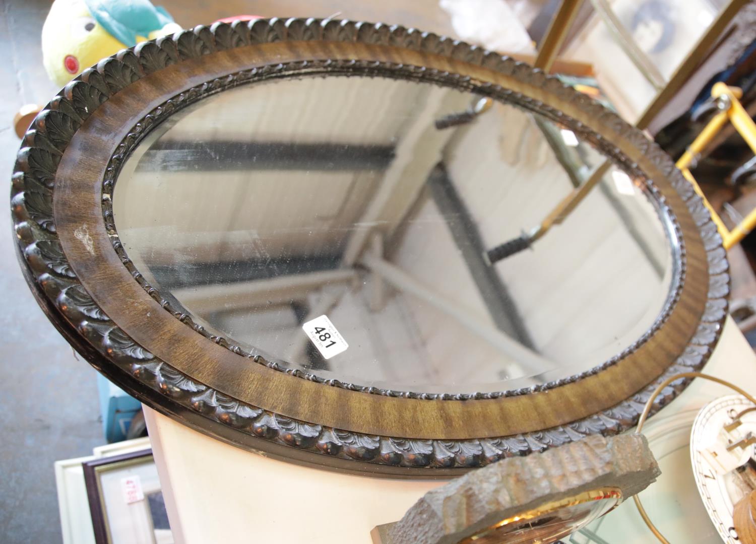 Large antique bevelled edge oval mirror. This lot is not available for in-house P&P