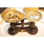 Vintage balance scale with brass pans and weights. This lot is not available for in-house P&P.
