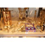 Shelf of brass ornaments and companion sets. This lot is not available for in-house P&P.