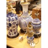 Four blue and white Oriental type table lamps. This lot is not available for in-house P&P