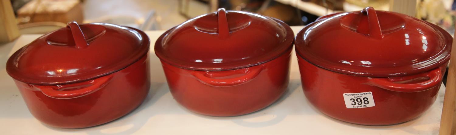 Three Le Creuset type casserole dishes with lids. This lot is not available for in-house P&P