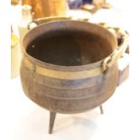 Large cauldron with tripod base and brass handle. This lot is not available for in-house P&P