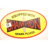 Cast iron Champion Spark Plugs sign, 28 x 17 cm. P&P Group 2 (£18+VAT for the first lot and £2+VAT