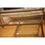 Brass framed glass top coffee table, 70 x 36 cm with shorter square example. This lot is not