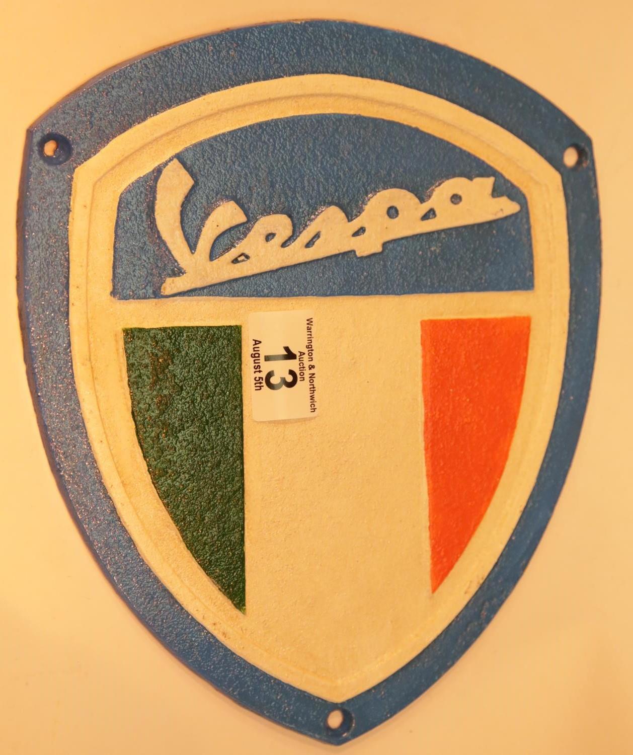 Cast iron Vespa shield, 26 x 22 cm. P&P Group 2 (£18+VAT for the first lot and £2+VAT for subsequent