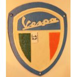 Cast iron Vespa shield, 26 x 22 cm. P&P Group 2 (£18+VAT for the first lot and £2+VAT for subsequent