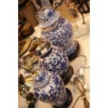 Three Oriental type blue and white table lamps of various designs. This lot is not available for