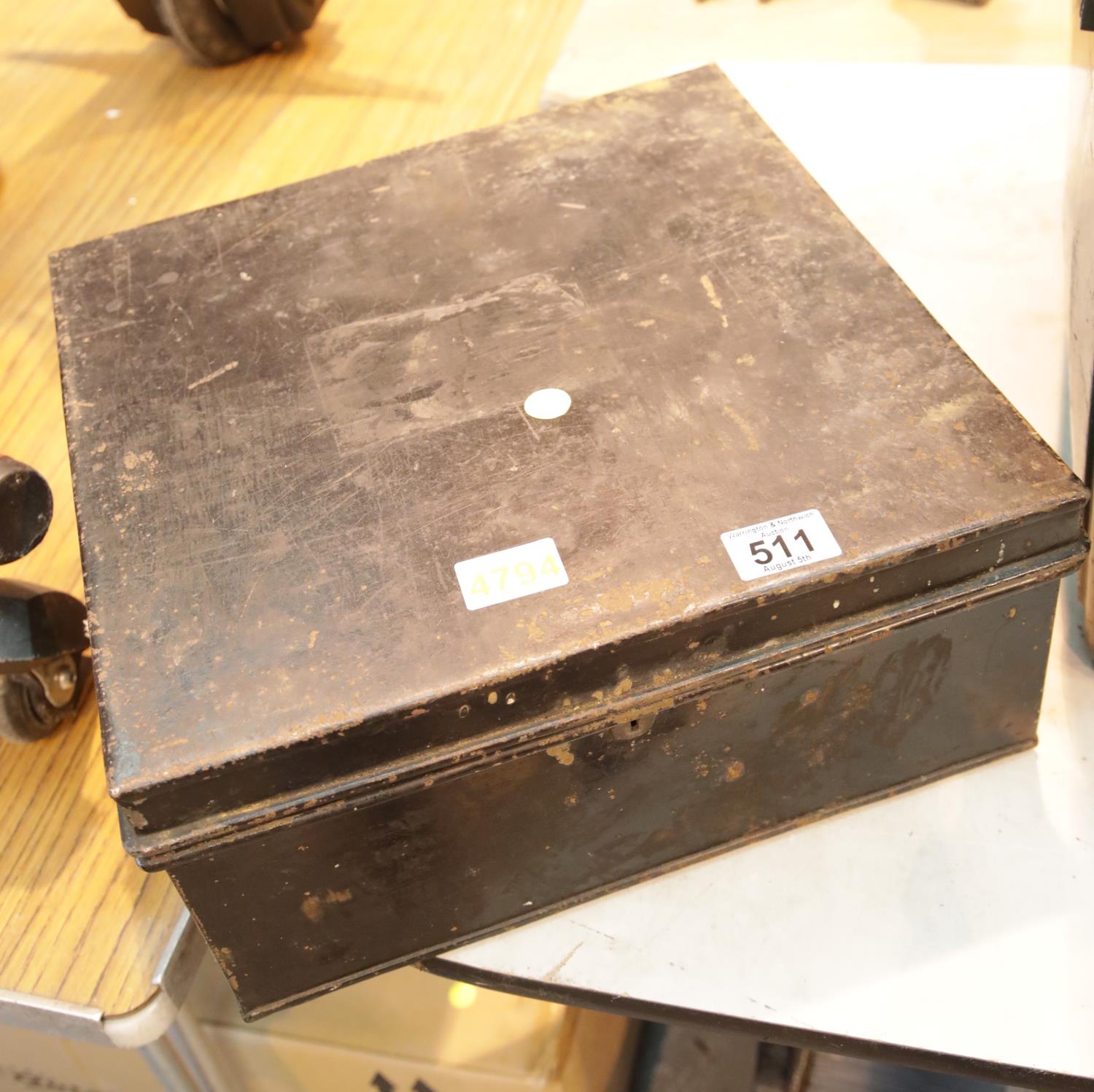 Large black painted steel strong box with no key. This lot is not available for in-house P&P