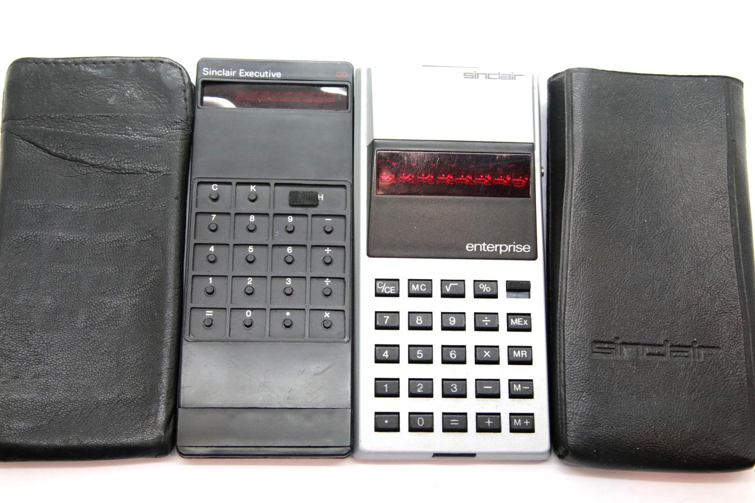 2x Sinclair Calculators including an Enterprise in silver and an Executive, both in slip cases. P&