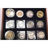 Lined box containing mixed crowns and medallions. P&P Group 2 (£18+VAT for the first lot and £2+