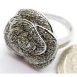 Silver and diamond flowerhead cocktail ring Size O. P&P Group 1 (£14+VAT for the first lot and £1+