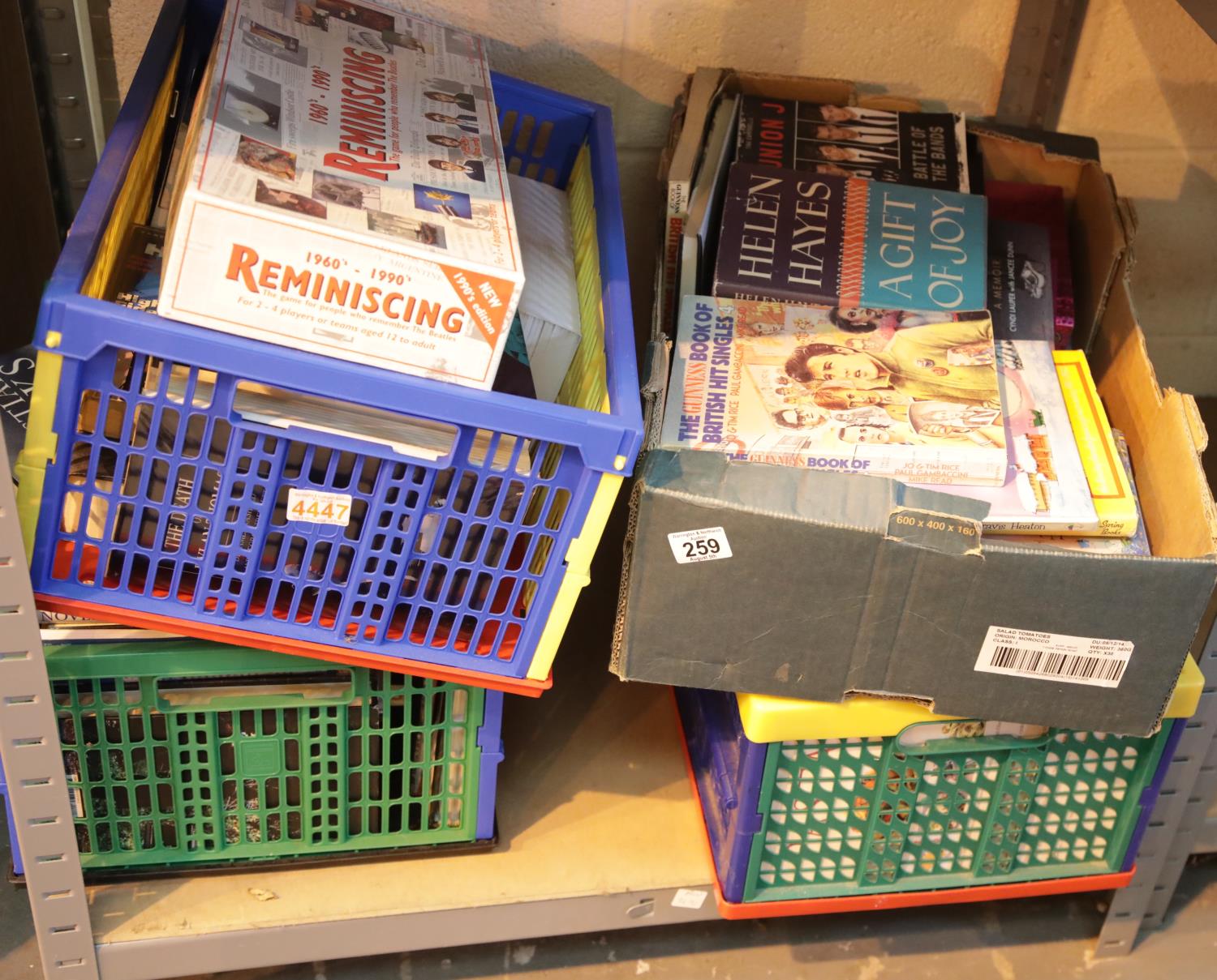 Four boxes of books containing several record collectors price guides, novels etc. This lot is not