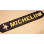 Cast iron Michelin sign, 48 x 9 cm. P&P Group 2 (£18+VAT for the first lot and £2+VAT for subsequent