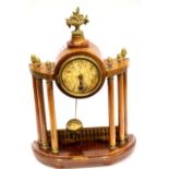 Walnut framed mantel clock on six pillar supports with pendulum. P&P Group 3 (£25+VAT for the