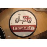Cast iron Lambretta sign, D: 29 cm. P&P Group 2 (£18+VAT for the first lot and £3+VAT for subsequent