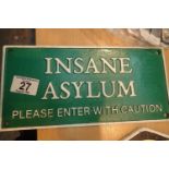 Cast iron Insane Asylum sign, L: 27 cm. P&P Group 2 (£18+VAT for the first lot and £3+VAT for