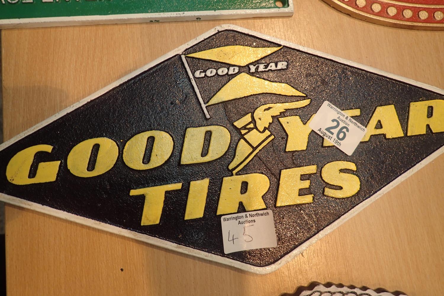 Cast iron Goodyear tyres sign, L: 39 cm. P&P Group 2 (£18+VAT for the first lot and £3+VAT for