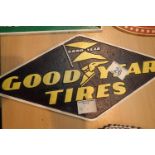 Cast iron Goodyear tyres sign, L: 39 cm. P&P Group 2 (£18+VAT for the first lot and £3+VAT for