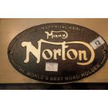 Cast iron Manx Norton sign, D: 24 cm. P&P Group 2 (£18+VAT for the first lot and £3+VAT for