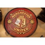 Cast iron Manchester United sign, D: 24 cm. P&P Group 2 (£18+VAT for the first lot and £3+VAT for