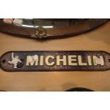 Cast iron blue Michelin sign, L: 48 cm. P&P Group 2 (£18+VAT for the first lot and £3+VAT for