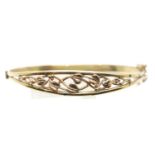 9ct yellow gold bangle with rose gold floral decoration, 11.1g, D: 5.5 cm approximately. P&P Group 1