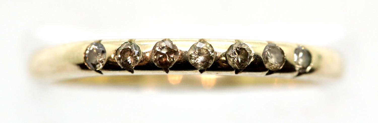 9ct gold band set with seven small citrines, size O/P, 1.8g. P&P Group 1 (£14+VAT for the first